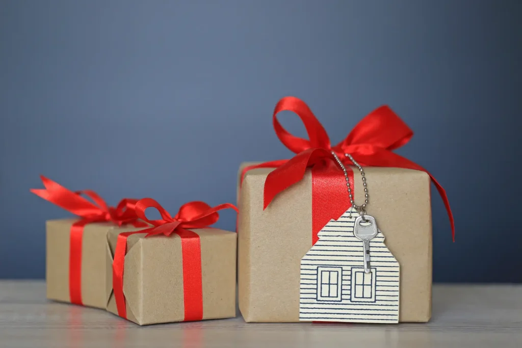 gift box with red ribbon house model with keys gift new home real estate concept